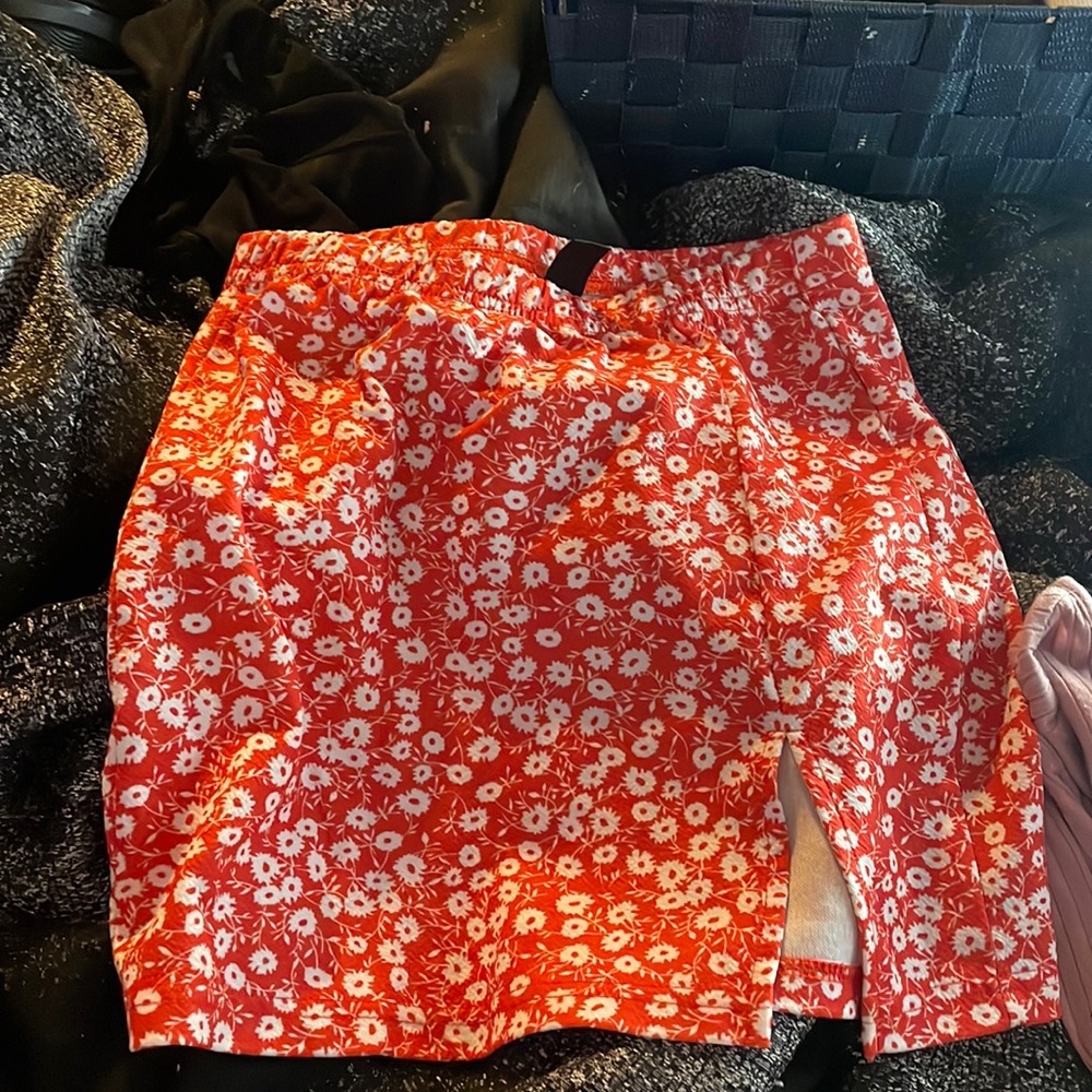 x’s skirt cut at the leg